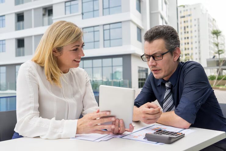 An expert consulting a businessman on using a business line of credit to boost business growth